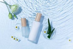 top-view-skincare-bottles-light-blue-water-surface-with-aloe-vera-daisy-flowers_181624-29524.jpg