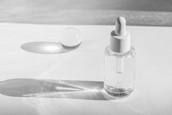 hyaluronic-polyglutamic-acid-oil-white-with-sunlight-shadow-copy-space_284704-454.jpg