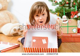 stock-photo-cute-girl-with-christmas-gifts-228623716.jpg