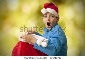 stock-photo-child-with-surprise-christmas-gifts-231713710.jpg