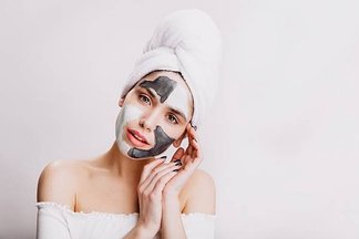 close-up-portrait-attractive-girl-doing-facial-mask-before-bedtime-adult-woman-posing-white-wall_197531-13976.jpeg