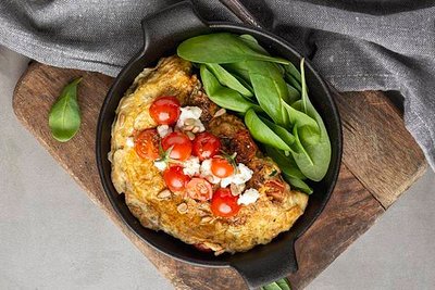 omelette-with-cheese-tomatoes-cutting-board_23-2148698680