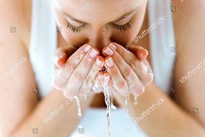 stock-photo-portrait-of-beautiful-young-woman-washing-her-face-splashing-water-in-a-home-bathroom-1170991717(1)(1).jpg