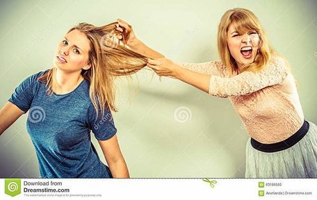 aggressive-mad-women-fighting-each-other-pulling-hair-two-young-girls-struggling-win-catfight-violence-63186560.jpg