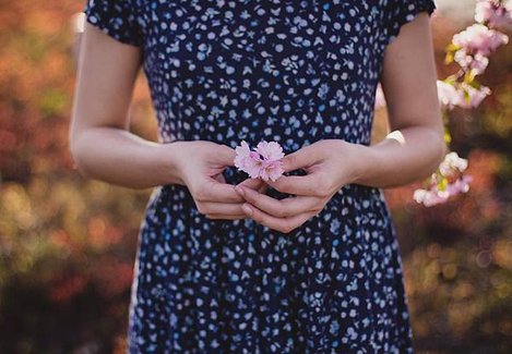 women-in-blue-and-white-floral-dress-with-pink-flower-on-92332