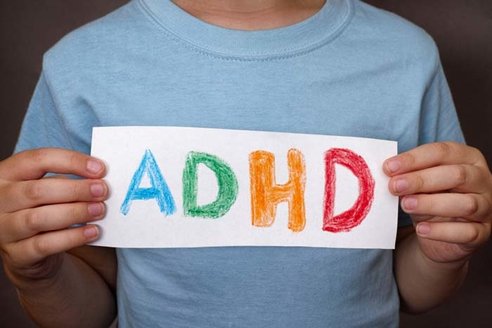 adhd-child-holding-notice.jpg