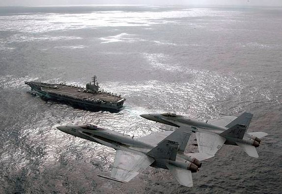 US_Navy_070301-N-1689P-002_Capt._Craig_Williams_foreground_and_Capt._Richard_Butler_fly_F-A-18C_Hornets_above_USS_Ronald_Reagan_CVN_76_during_their_airborne_change_of_command_ceremony