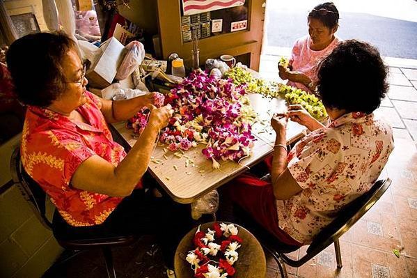 HTA_01022-Women making lei at a downtown lei stand