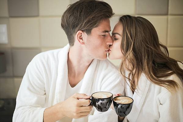 photo-of-couple-in-white-bathrobes-kissing-while-holding-3756356