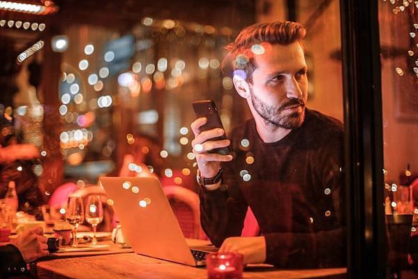 Canva - Man Holding Black Smartphone