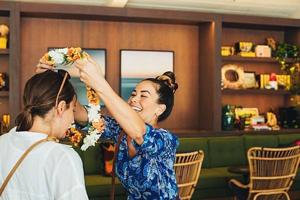 Woman greeting a friend with a lei Waikiki