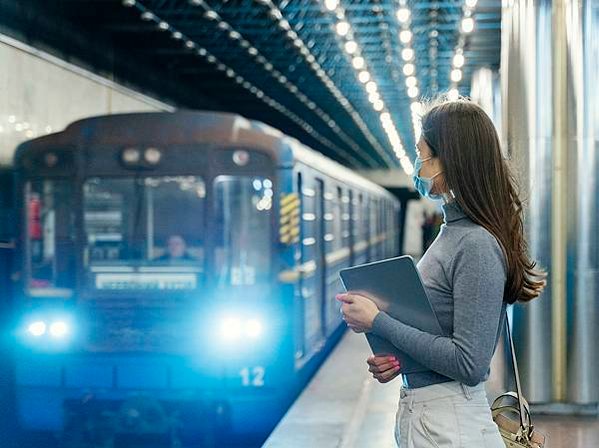 young-woman-waiting-subway-station-with-tablet