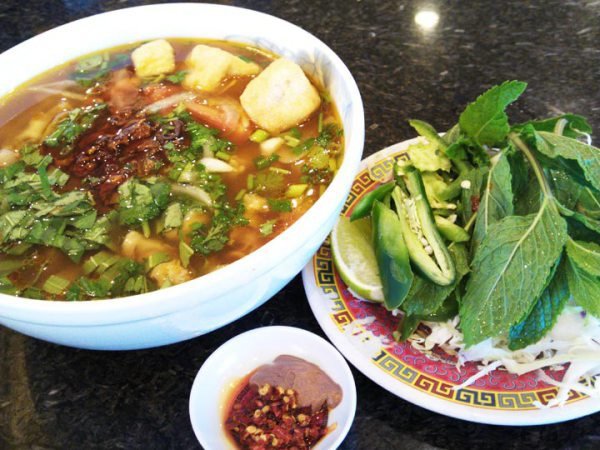Bun Rieu Oc - Crab tomato noodle soup with minced meat and periwinkle