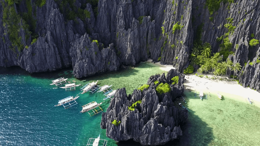 aerial-view-of-secret-lagoon-at-miniloc-island-with-karst-cliffs-and-white-beach-bacuit-bay-el-nido-palawan-island-philippines_bcs_vqcul_thumbnail-full01.png