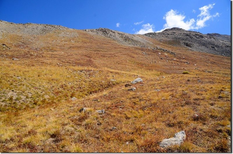 At 12,400 ft., cross a flat area before climbing up to the northwest ridge