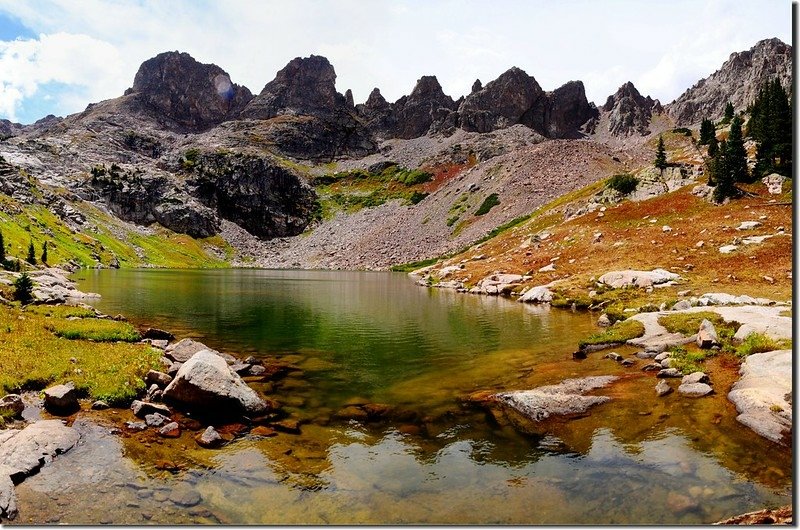 Glacier ground rock creates a greenish hue in Upper Willow Lake 1