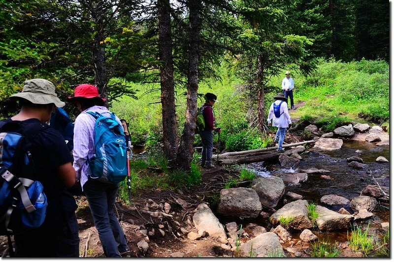 Crossing Meadow Creek on a makeshift bridge