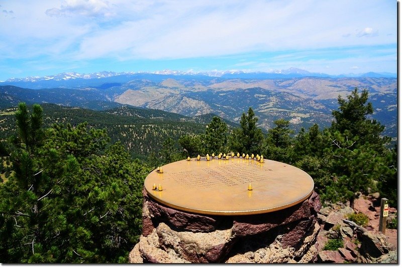 The summit marker on Green Mountain identifies distant peaks