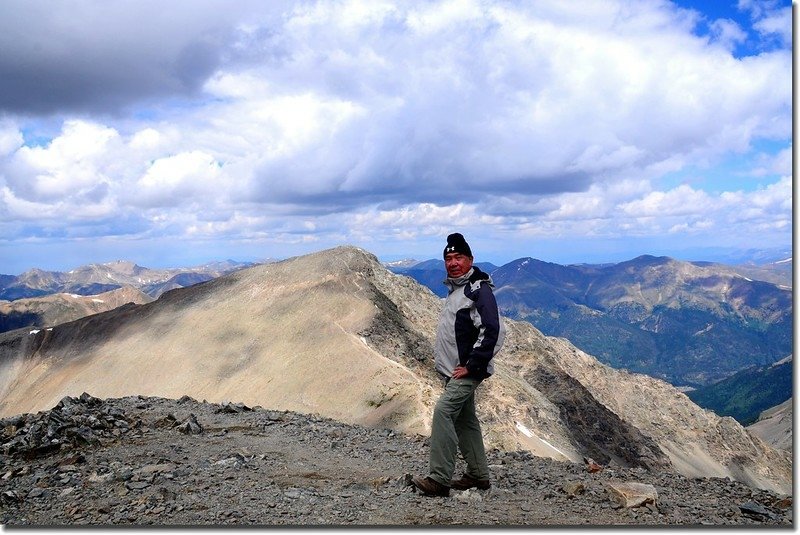 On the Grays&apos; summit, background is Torreys Peak