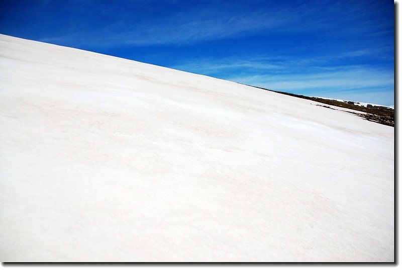 On the hillside snow has not melted