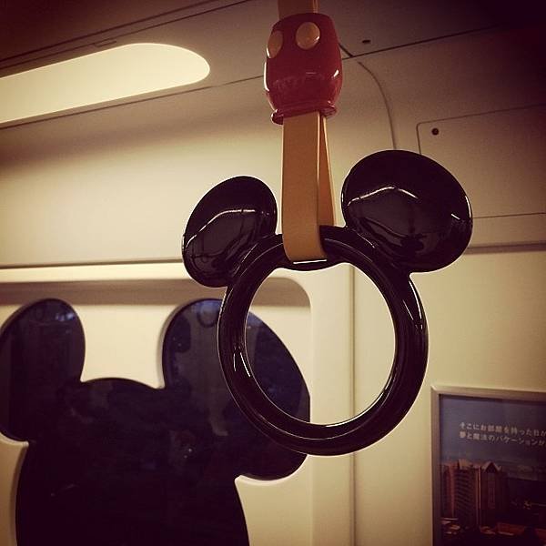 Mickey_Mouse_standing_passengers_in_Maihama_Resort_Line