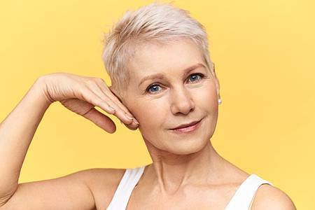 portrait-attractive-middle-aged-caucasian-woman-tank-top-touching-cheek-applying-anti-wrinkle-moisturizing-cream-looking-camera-with-smile_343059-1961.jpg