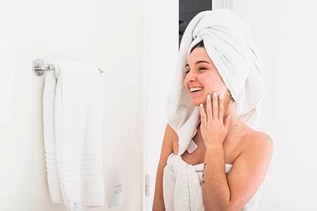 beautiful-woman-with-towel-wrapped-head-looking-mirror_23-2148161302.jpg