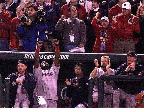 David Ortiz points skyward with two outs in the ninth as Red Sox players and fans anticipate the final out and the pure, unadulterated joy that would follow. (2004 World Series).jpg