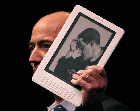 Amazon CEO Jeff Bezos holds the new Kindle DX.bmp