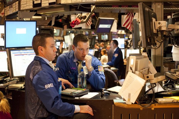 Traders work the floor at the New York Stock Exchange on November 27, 2009 in New York City. U.S. markets opened lower on Friday, reacting to global worries over Dubai&apos;s debt problems..bmp