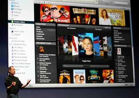 Apple Chief Executive Steve Jobs introduces full-length, high-resolution movie downloads from the iTunes website to a crowd at the Apple media center last fall.