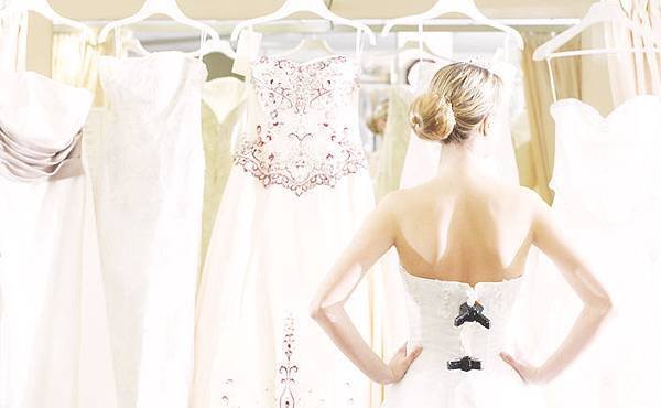 girl-looking-at-wedding-dresses-w724