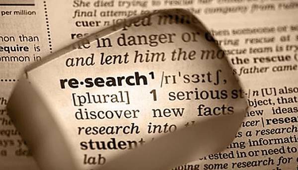 research_word_in_dictionary_magnified_sepia