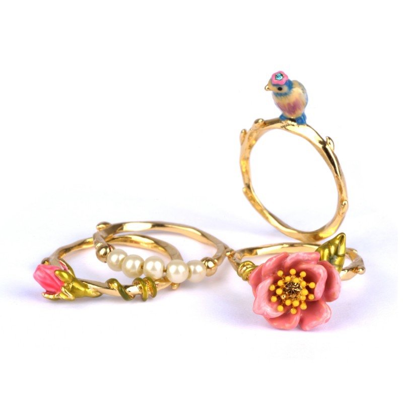 four-rings-with-tit-flower-bead-and.jpg