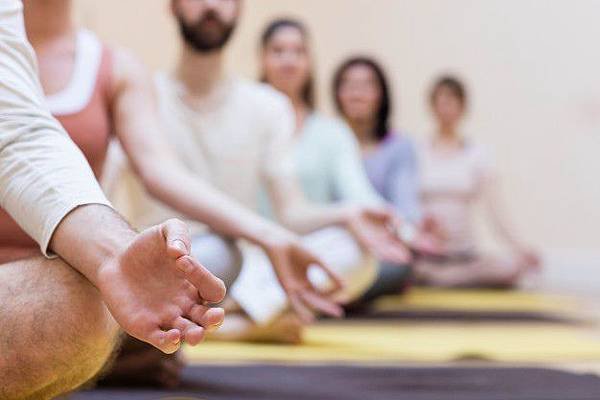 group-of-people-doing-meditation-on-exercise-mat_1170-226.jpg