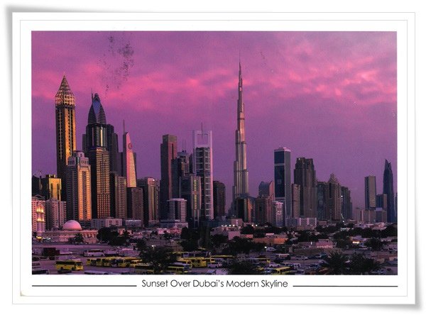 sunset over dubai&apos;s modern