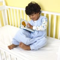 EW-Blue-in-crib-reading.jpg