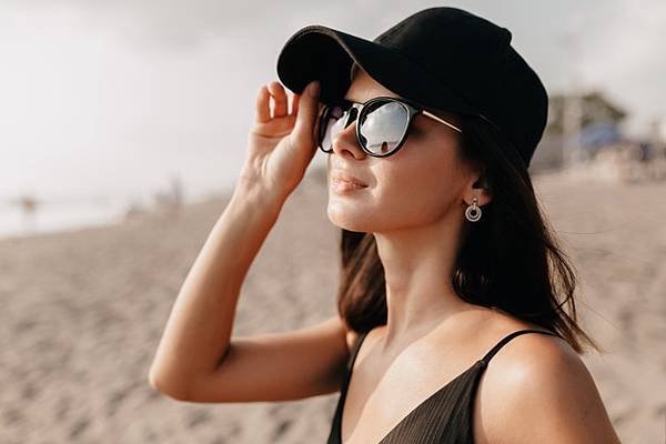 stylish-modern-woman-trend-outfit-looking-ocean-with-happy-smile-wearing-cap-glasses-enjoys-summer-hot-days-young-caucasian-female-model-sea-shore_291650-827.jpg