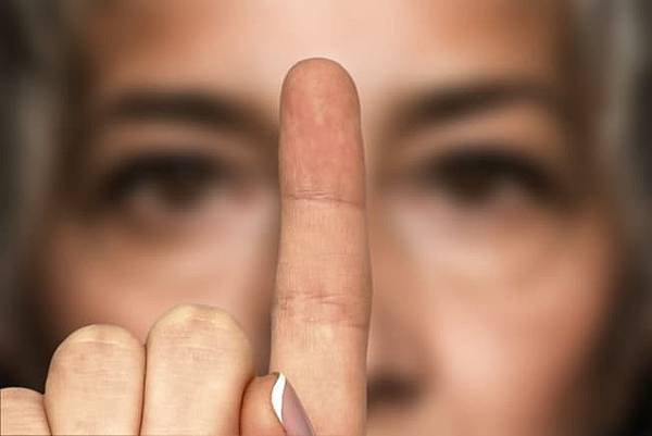 7_getty_rf_woman_looking_at_finger.jpg