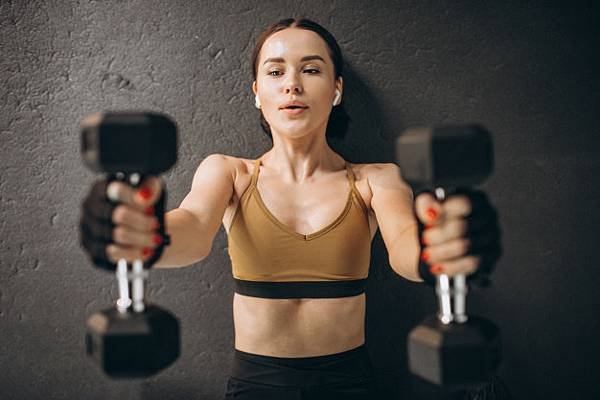 young-attractive-woman-exercising-with-dumbbells-gym_1303-22583.jpg