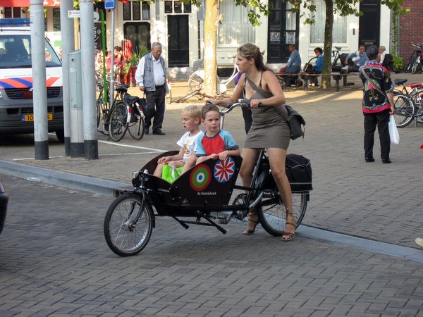 cargo bike with two kids and skirt