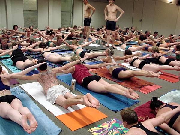 2-yoga_students_practice_the_full_locust_pose_at_the_4cbff56528