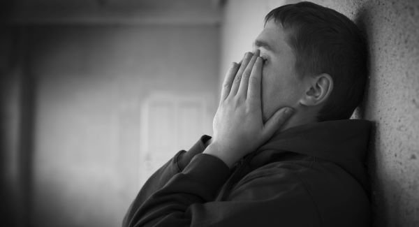 SadStressedTeenagerHeadInHands_large
