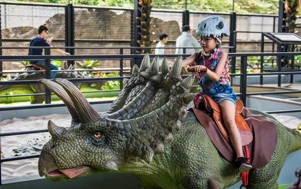 Riding a dinosaur at Dino Farm2.jpg