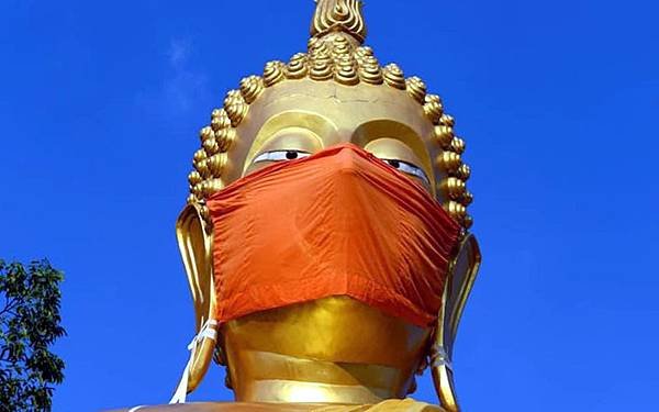 Wat Nithet Rat Pradit Buddha wears mask.jpg