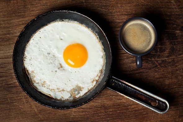 fried-egg-and-coffee-on-wooden-table.jpg