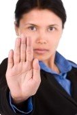 3687043-a-young-woman-using-her-hand-to-stop-something-directing-to-the-camera-focus-mainly-on-the-palm-shoo.jpg