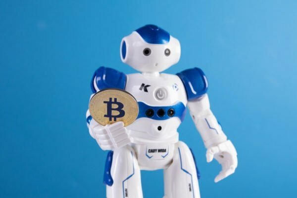 robot-holding-bitcoin-e1649314333968.jpg