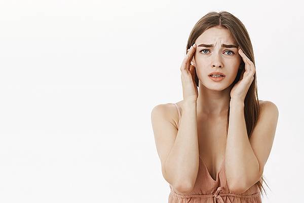 woman-having-headache-during-periods-feeling-frustrated-concerned-touching-temples-frowning-from-discomfort-suffering-from-painful-feeling-migraine-standing-concerned-PX1000.jpg