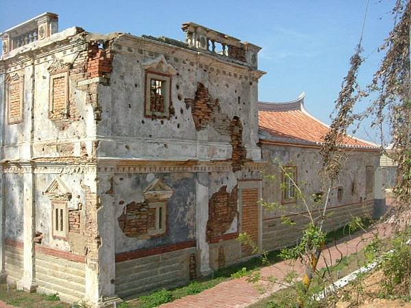 The old building with the bullet hole